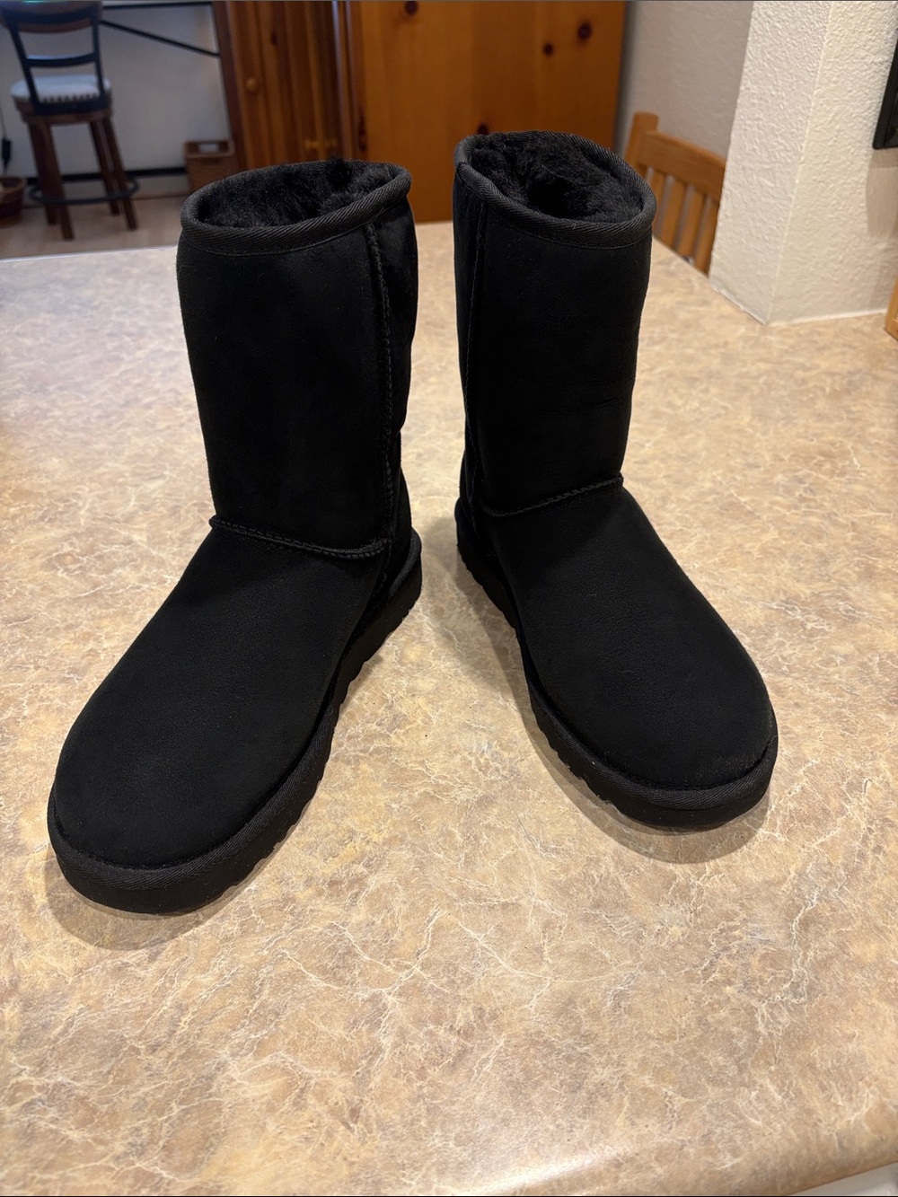 UGG Mid-calf black leather boots. Excellent condition. Worn once.